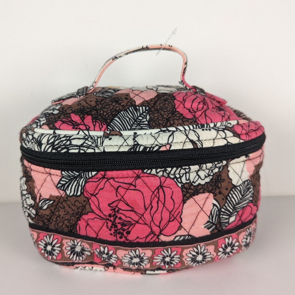 Vera Bradley-Small round travel bag. Different shades of pink and brown.